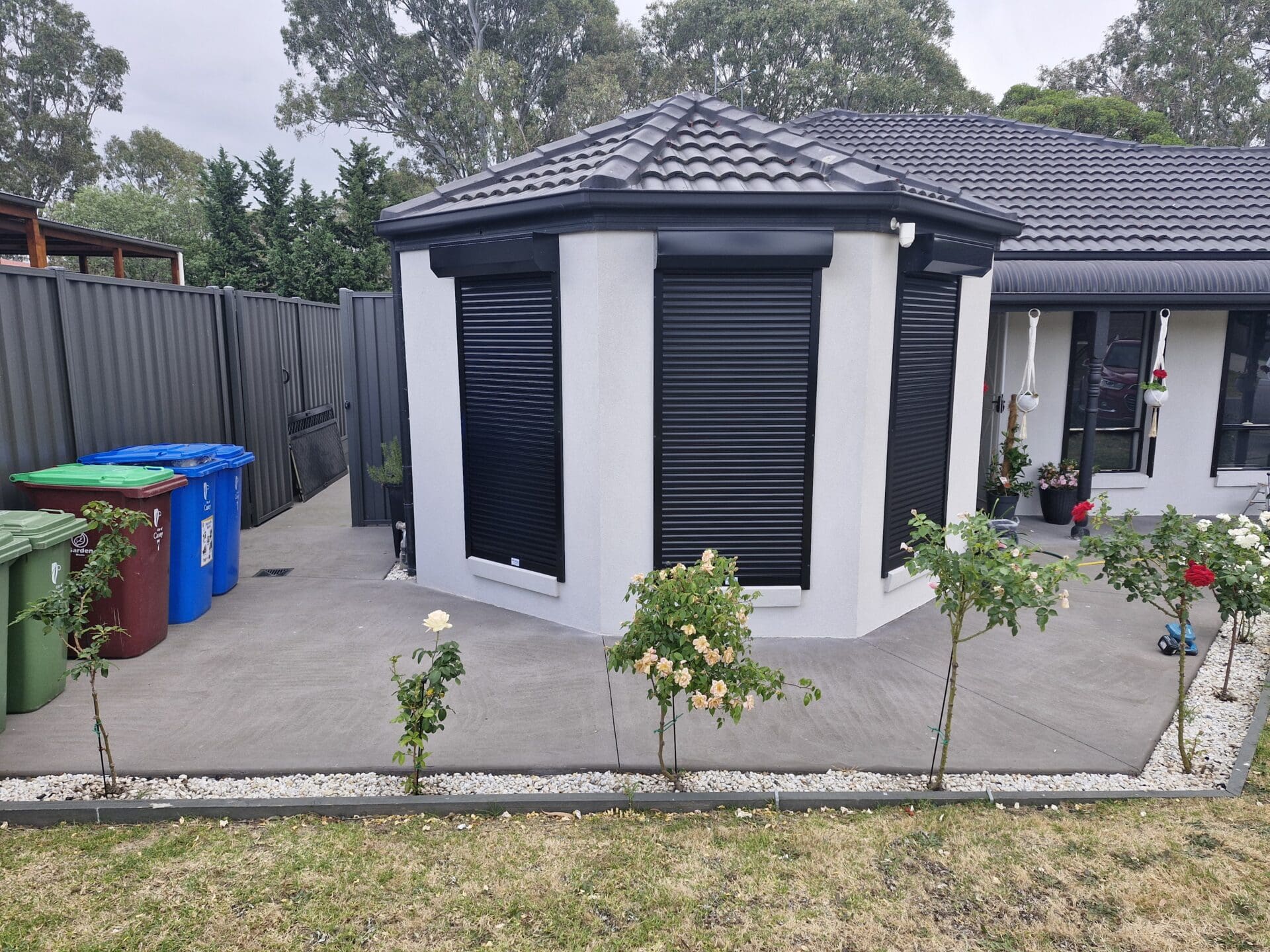 Outdoor roller shutters, brick house